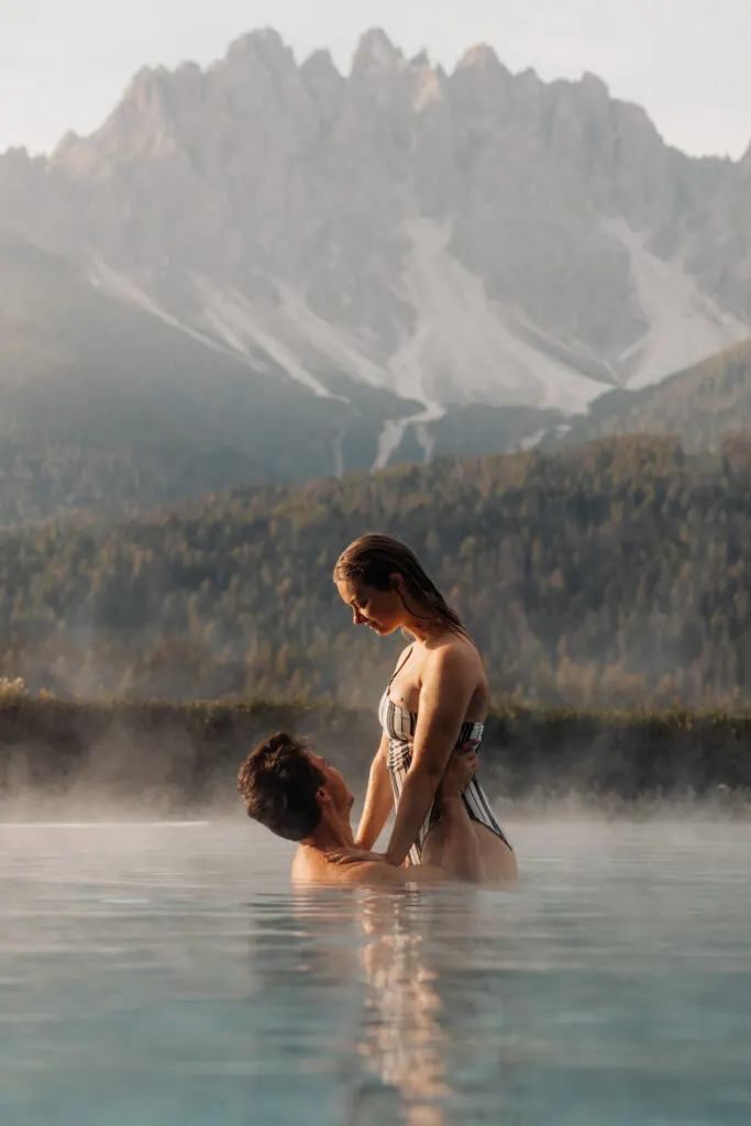 Couple in the steaming outdoor pool at Leitlhof in the Dolomites